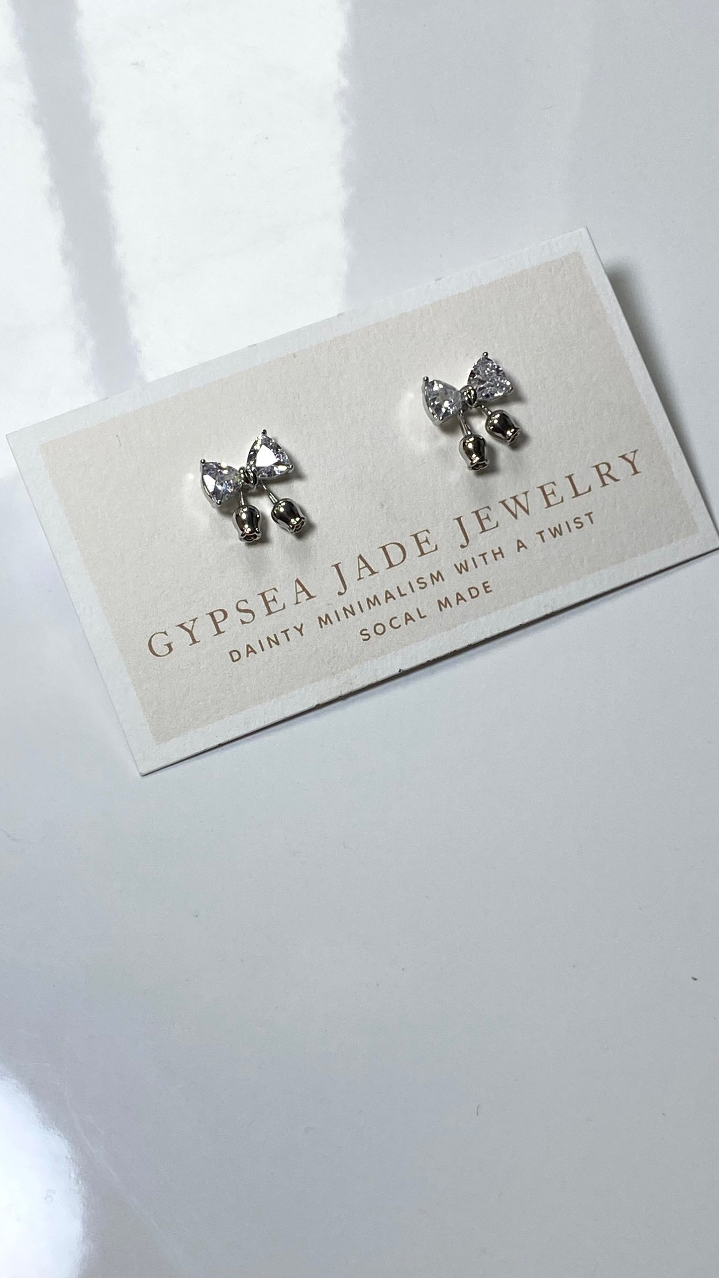 Bow statement earrings in Silver